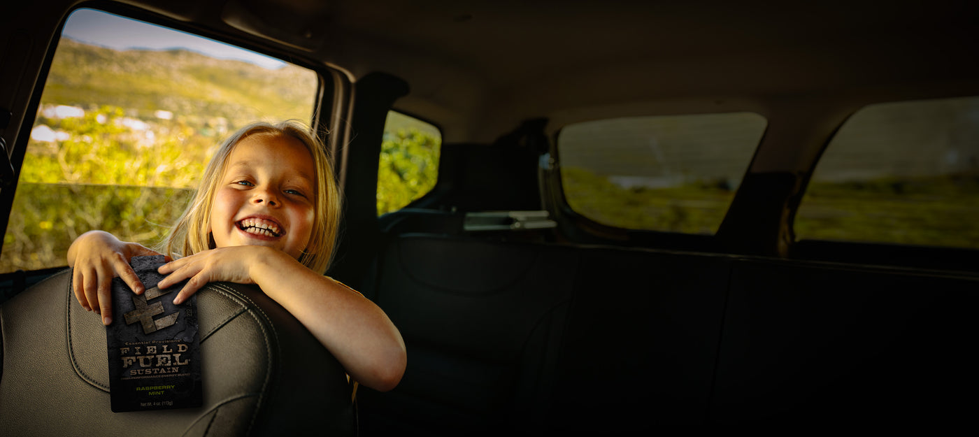 Smiling Little girl in car with Packed MRE by Essential Provisions
