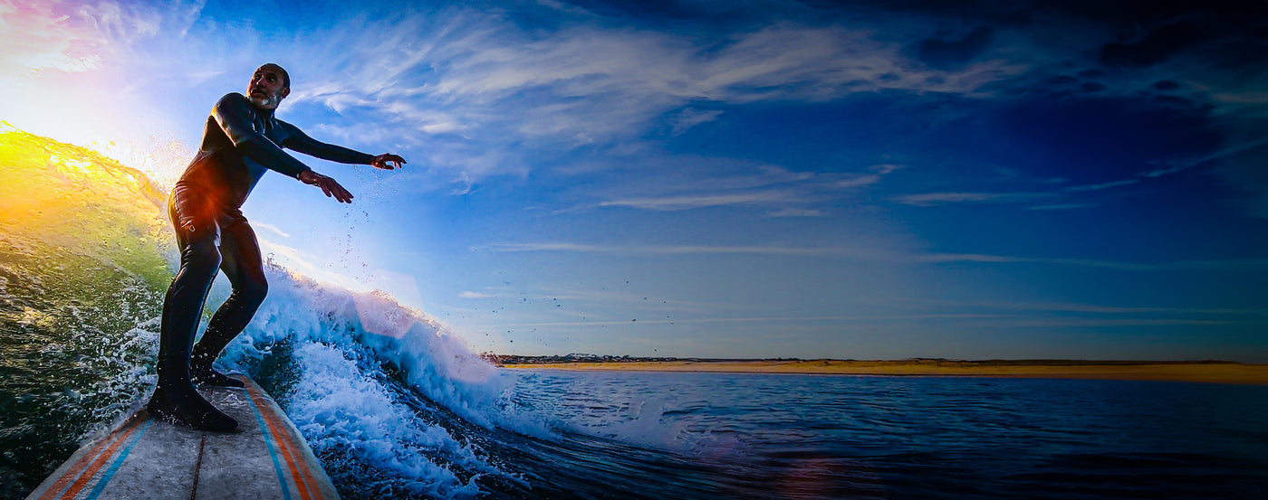 Active elderly man enjoying surfing for longevity